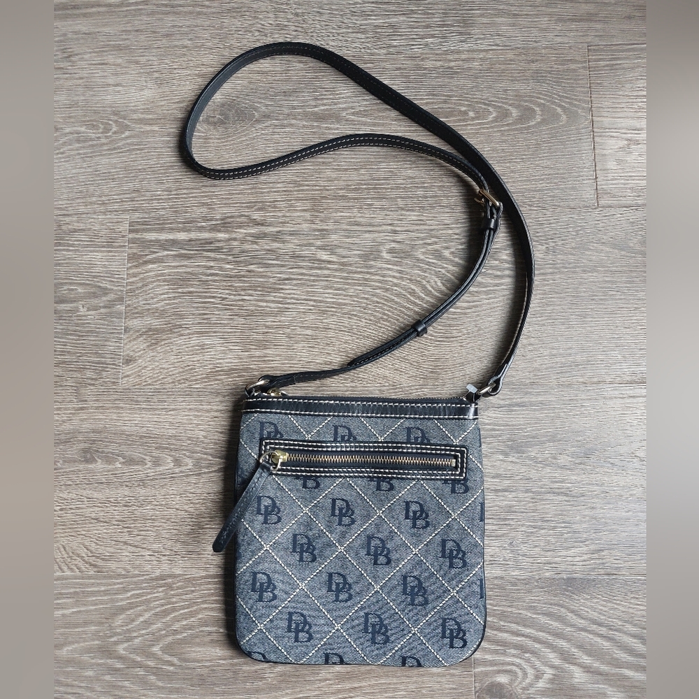 Authentic Dooney and Bourke navy canvas leather crossbody.